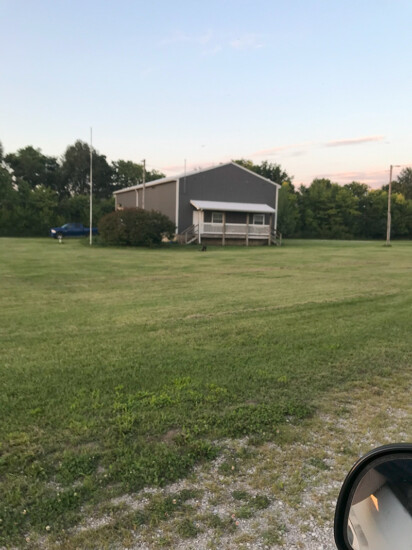 house with green grass in front